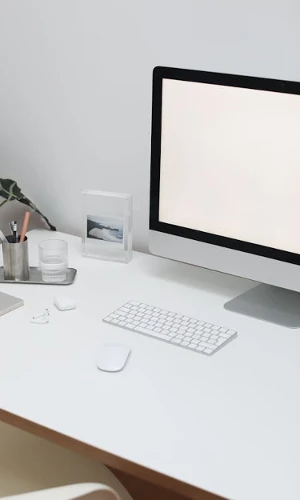 Computer with a blank screen in an office setting