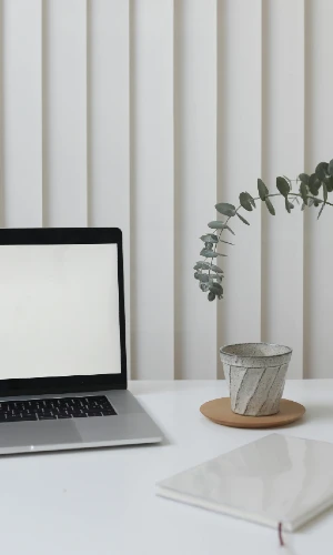 Laptop with a blank screen in an office setting